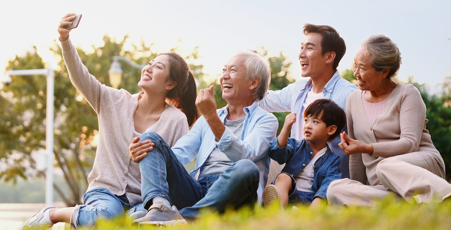 A smiling family together outdoors